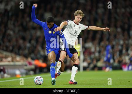 josh-acheampong-of-chelsea-under-pressure-from-c-sar-palacios-of-fulham