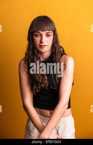 Young woman dancer posing confident with curly hair Stock Photo