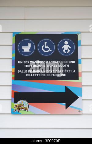 Directional sign to unisex washrooms at Magnetic Hill in Moncton, New Brunswick, Canada Stock Photo