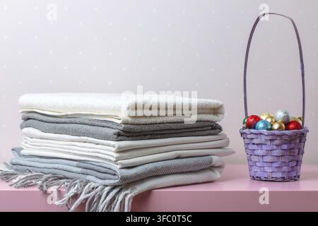 A stack of folded blankets, sheets and towels Stock Photo