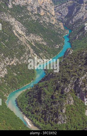 Little canoes navigating on de Verdon river in the canyon, seen from the viewpoint of the cirque de Vaumale Stock Photo