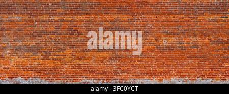 Detail of the historic red brick wall surrounding the Walled Garden at Holkham Hall in Norfolk, England, showing weathered masonry, varied brick tones Stock Photo