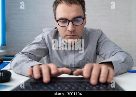 Coding, office and man on computer for programming, system upgrade and software design. Network, IT programmer and worker with pc for web development, Stock Photo