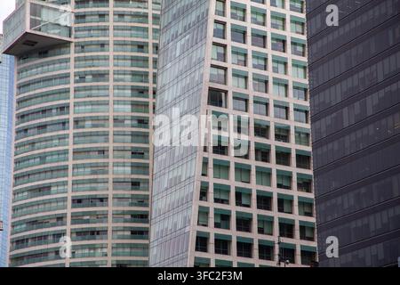 abstract close-up view of the facades of modern high-rise glass and steel skyscrapers Stock Photo