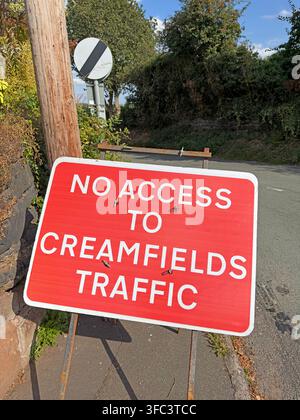 Red 'No Access to Creamfields Traffic' sign on a narrow rural lane at Daresbury, Cheshire, protecting local roads during the 2026 festival. Stock Photo
