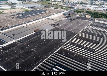 Commercial infrastructure building. Aerial warehouse distribution center with multiple loading docks. Parking infrastructure in industrial area Stock Photo