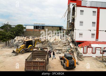 Cali, Colombia, August 10, 2026. Buildings destroyed following the devastating 7.4-magnitude earthquake that struck on August 10, 2026. Clearing away Stock Photo
