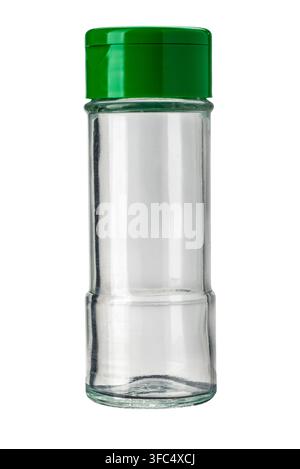 Empty transparent glass seasoning bottle with a green plastic dual-flip shaker cap, blank condiment container for kitchen herbs and spices storage. Is Stock Photo
