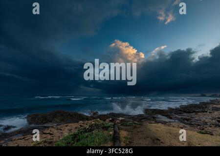 Stormy sky over the ocean at sunset after tropical storm in Oahu, Hawaii Stock Photo