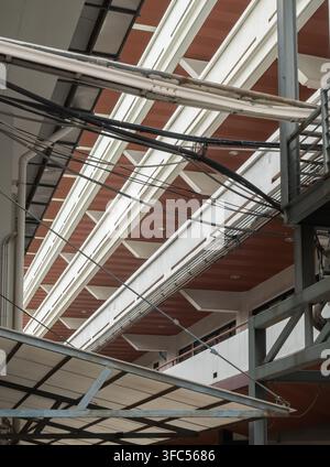 Bangkok, Thailand - 23 Aug, 2026 - A dramatic, low-angle shot looking up at the exterior facade of a modern multi-story building. The composition show Stock Photo