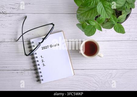 2027 goals with list on open notebook. Top view. Stock Photo