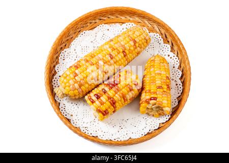 Boiled multicolored waxy corn cobs and cut segments isolated on white background Stock Photo