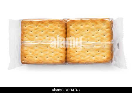 Cracker cookies in transparent packaging. Cracker packaging on a white background. Stock Photo