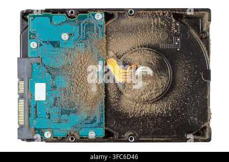 A dusty computer hard drive. Old hard drive on a white background. Repair and maintenance of the computer. Stock Photo