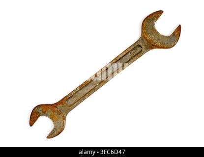 Rusty wrench on a white background. An old wrench close-up. Stock Photo