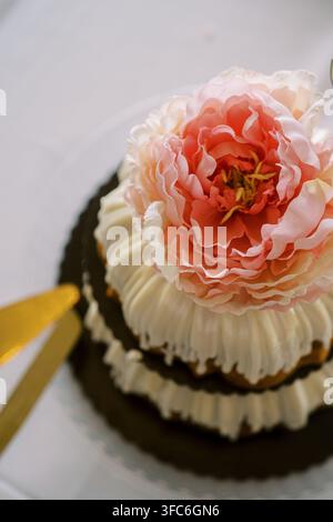 Elegant Wedding Cake with Large Pink Flower Decoration Stock Photo