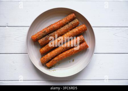Roasted carrots seasoned with herbs from viral airfryer recipe Stock Photo