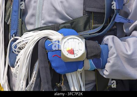Hand in glove with the parachutist altimeter close up Stock Photo