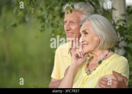 Portrait of a loving mature couple in the park in summer Stock Photo