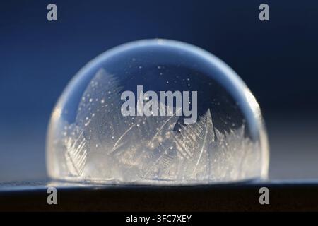 Frozen bubble in nature. A beautiful macro shot of nature in winter. Concept for Environment, Water and Frost Stock Photo