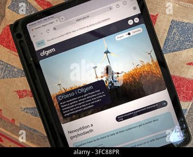 Ofgem website displayed in Welsh on a tablet, showing bilingual public information from Great Britain’s energy regulator. Stock Photo