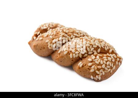 Traditional Greek Koulourakia twisted cookies with sesame seeds isolated on white background Stock Photo