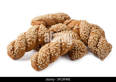 Traditional Greek Koulourakia twisted cookies with sesame seeds isolated on white background Stock Photo
