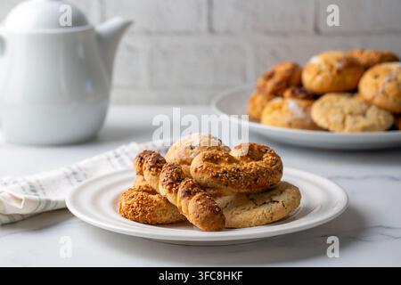 Assorted Traditional Bakery Cookies with White Teapot for Tea Time Stock Photo