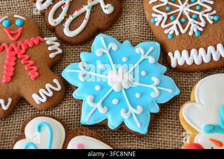 Assorted Gingerbread Cookies on Burlap texture, close up, high angle view Stock Photo