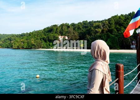 Side view of a beautiful young woman at Manukan island Sabah Borneo Malaysia Stock Photo