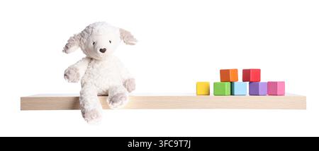 Wooden shelf with toys isolated on white Stock Photo