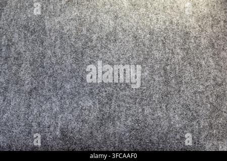 Soft gray wool felt fabric background showing a cozy, fuzzy melange of fibers and subtle texture, full frame, neutral backdrop ideal for textile, fash Stock Photo