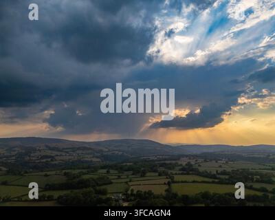 UK Weather: Wednesday 26th August 2026, A Met Office Weather Warning now in place for North Wales as thunder and lightning along with heavy rain is to arrive over the next 48hrs.  A view of the Clwydian Range Hills as the Severe Weather approaches the village of Lixwm, Flintshire, UK Stock Photo