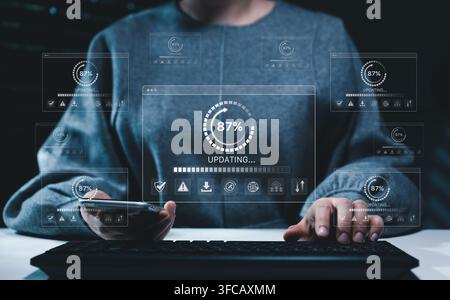 Software update and cybersecurity concept. User operating keyboard and smartphone with progress interfaces, system maintenance, data protection, Stock Photo