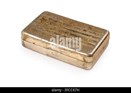 An old metal box on a white background. A dirty brass box. Stock Photo