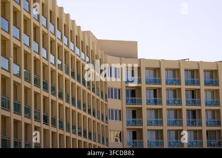 Modern facade of a beige-brown hotel with many windows, Roquetas de Mar, Roquetas, Costa de Almeria, Almeria Province, Andalucia, Spain Stock Photo