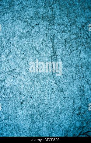 Abstract blue textured wall or painted surface with scratches, cracks and mottled marks, suitable as a grunge background Stock Photo
