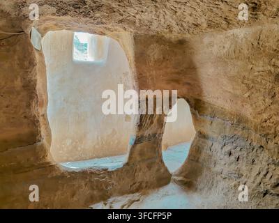 Sana'a, Yemen - Jul 06, 2023: Small cave called (burial cave) inside Dar Al Hajar ( stone house ), a royal  palace on rock located in Wadi Dhahr. Stock Photo