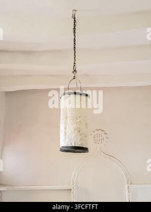 Old candle lantern hanging from the ceiling, Yemeni lantern. Stock Photo