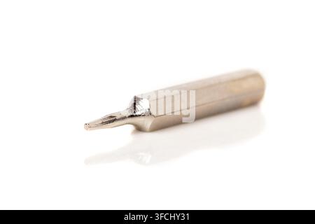 A set of different attachments for a head screwdriver with a screwdriver on a white background close-up Stock Photo