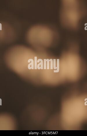 An abstract brown background featuring soft bokeh and defocused light circles. Ideal for warm, moody, or organic design concepts and professional over Stock Photo