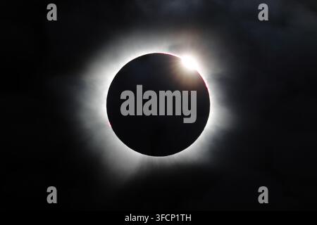 Total solar eclipse with diamond ring effect, with the Sun's corona around Moon, seen off the north-west coast of Isafjordur, Iceland,12th August 2026 Stock Photo