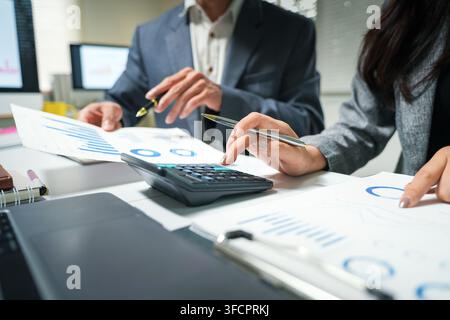 Business Team Analyzing Financial Reports Stock Photo
