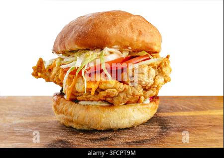 Crispy fried chicken sandwich with lettuce and tomato on a bun Stock Photo