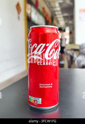 red aluminum can of Coca-Cola Classic soft drink. Singapore Stock Photo