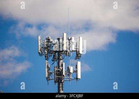 Close-Up Cellular Antenna Array Against Blue Sky Stock Photo