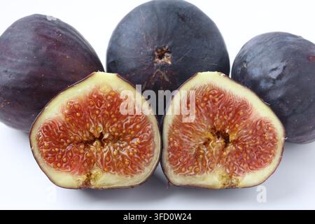 Fresh Halved and Whole Black and Green Figs Stock Photo