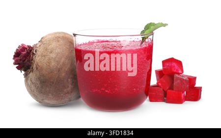 Beet juice. Fresh beverage in glass, whole and cut vegetables on white background Stock Photo