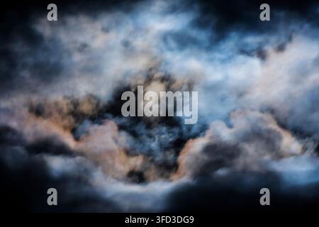 Time exposure; Full Sturgeon Moon back lights moving cloud cover; central Colorado; USA Stock Photo