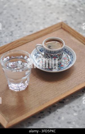 turkish Coffee and water served on a wooden tray Stock Photo